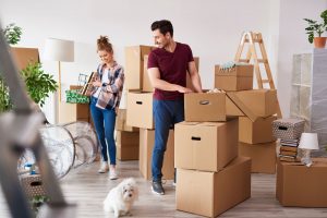 Couple organising their boxes for moving house