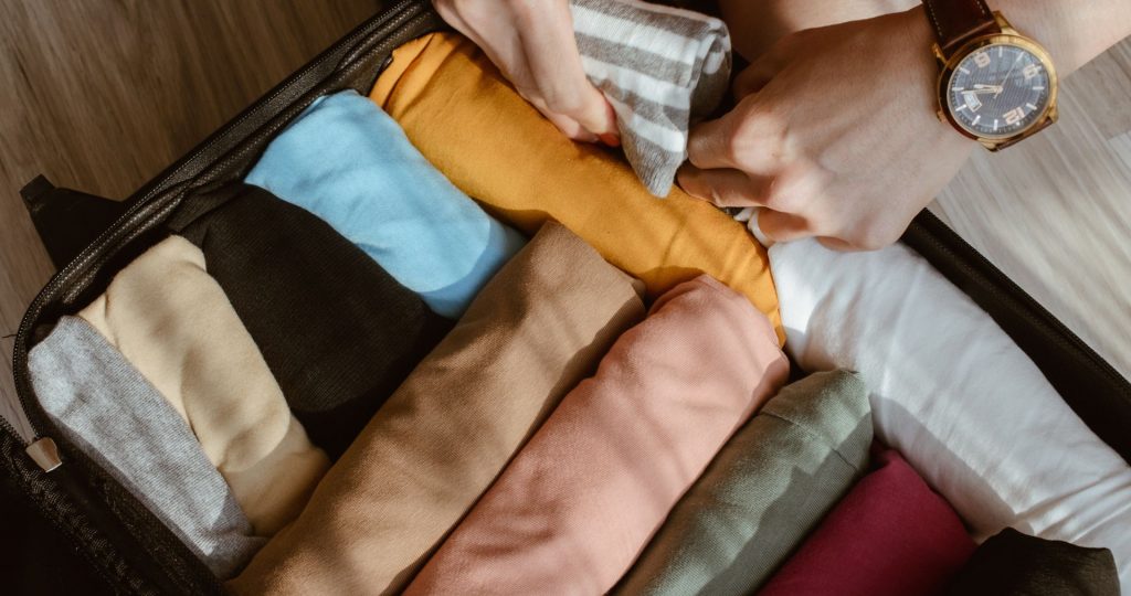 Clothes rolled up into bundles for easier storage