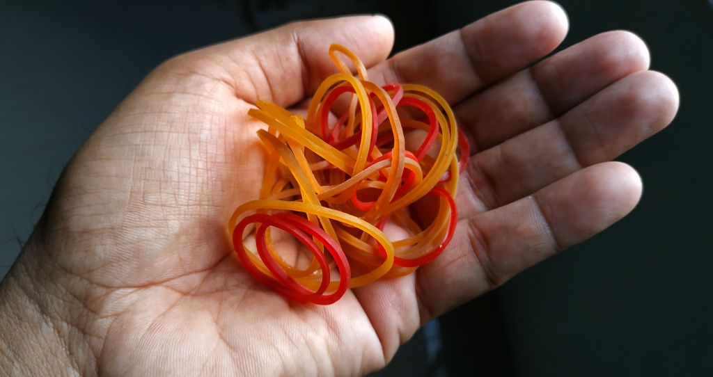 Person holding rubber bands