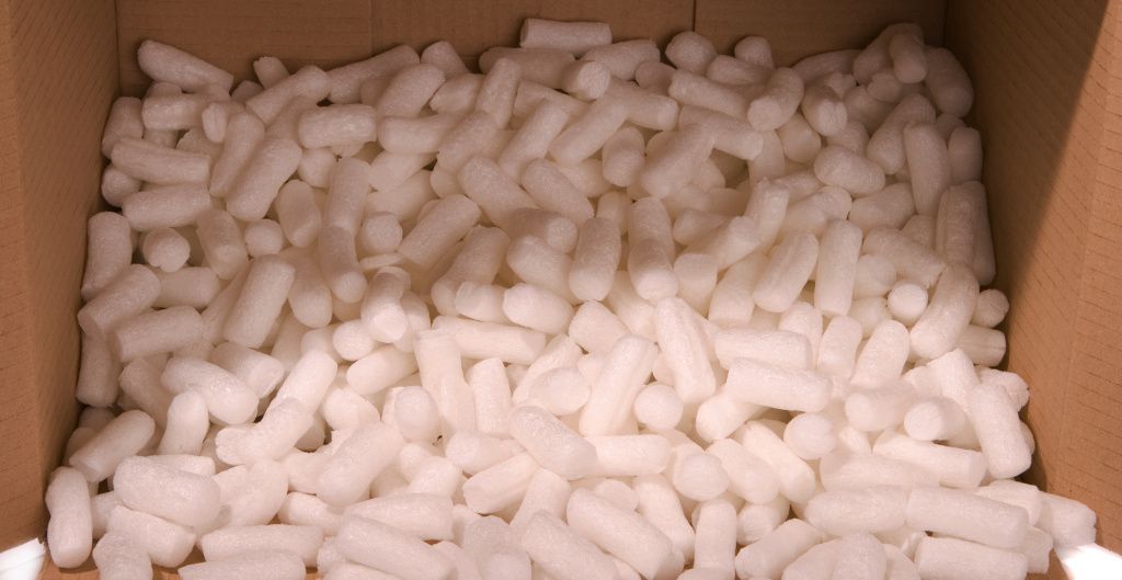 Biodegradable packing peanuts inside cardboard box